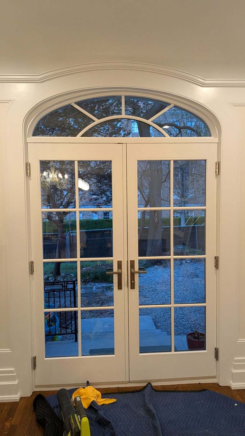 Custom arched French doors with divided glass