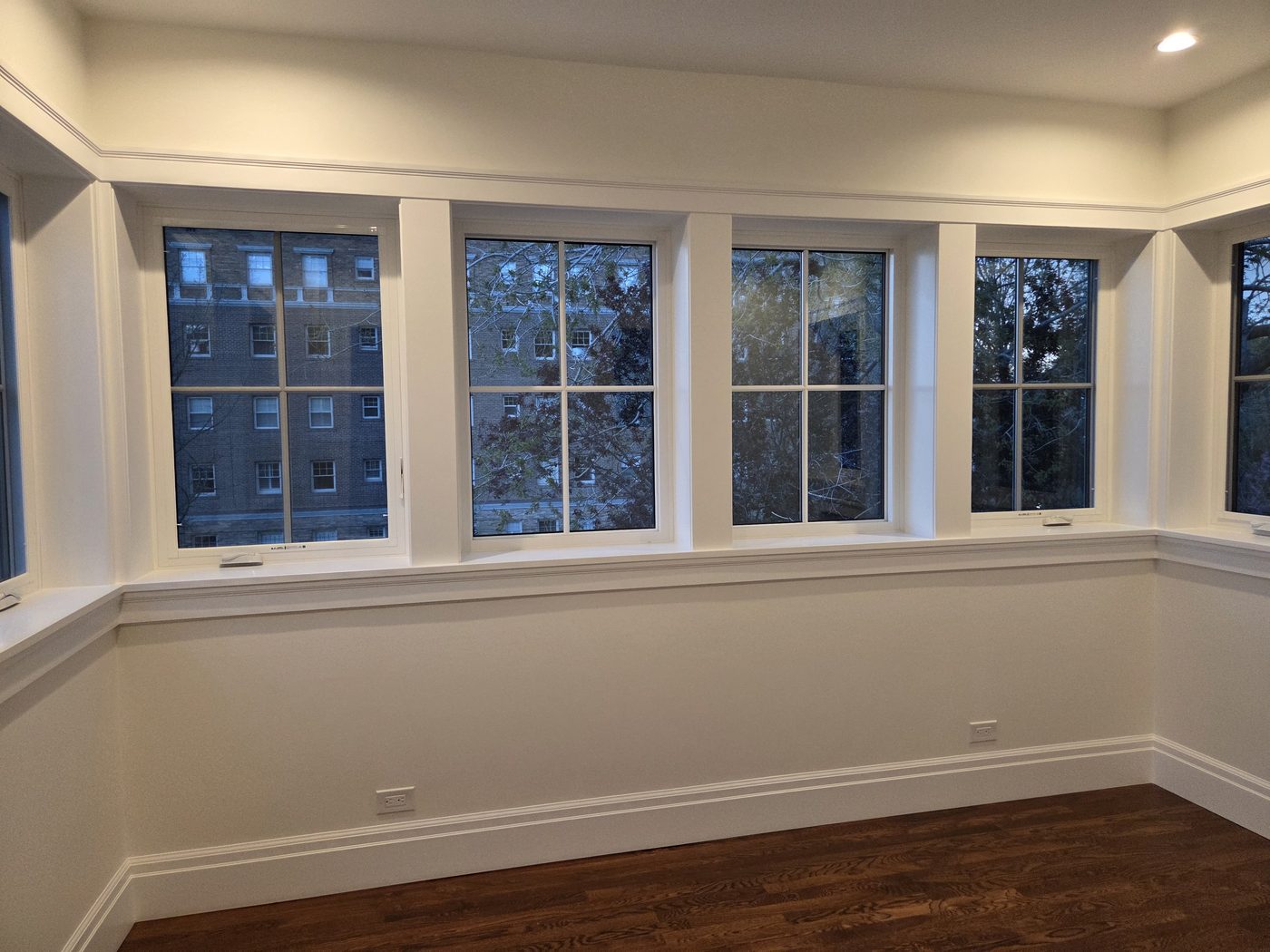 Bay windows with custom trim and wainscoting