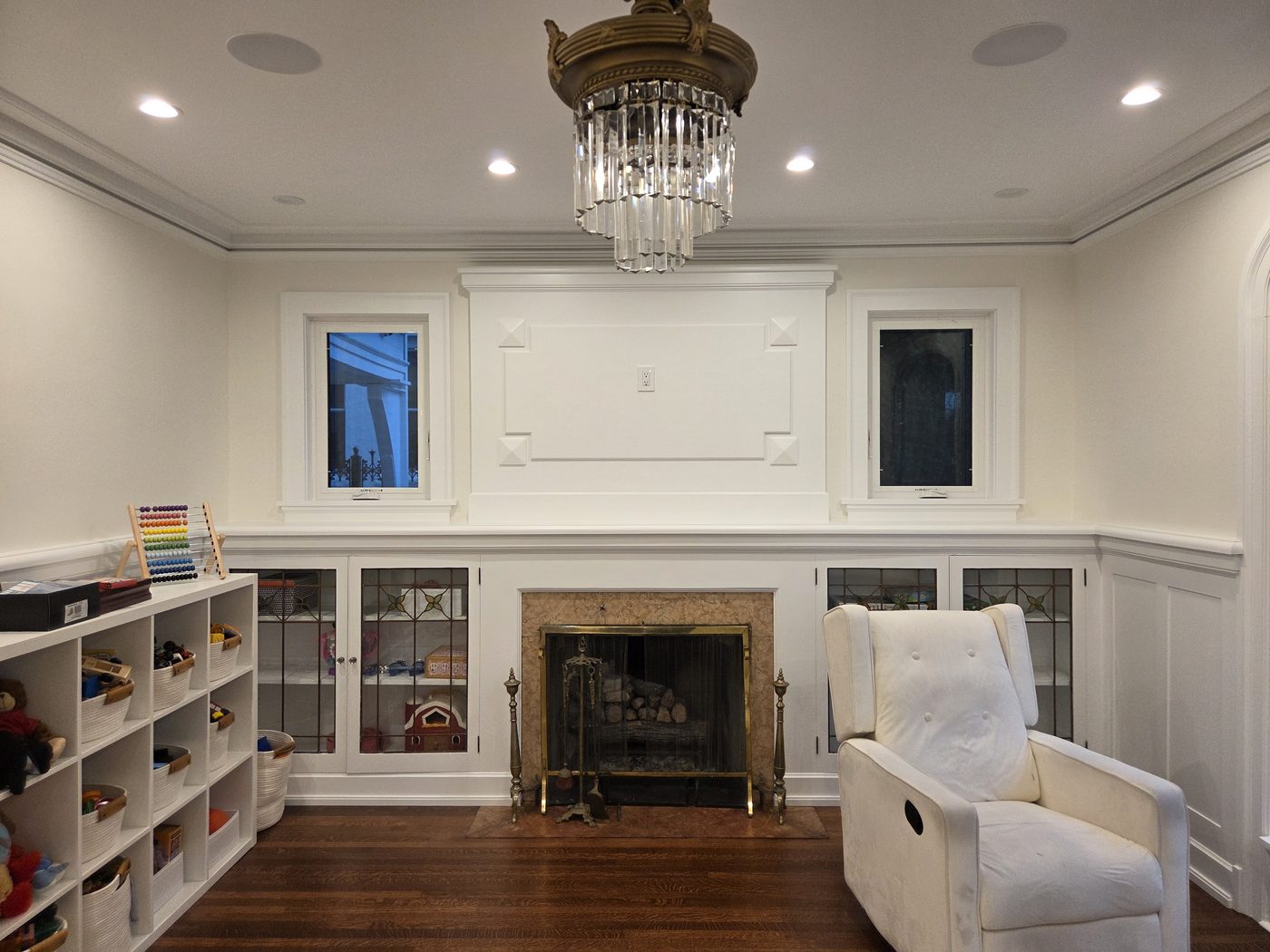 Custom built-in bookcases flanking a fireplace