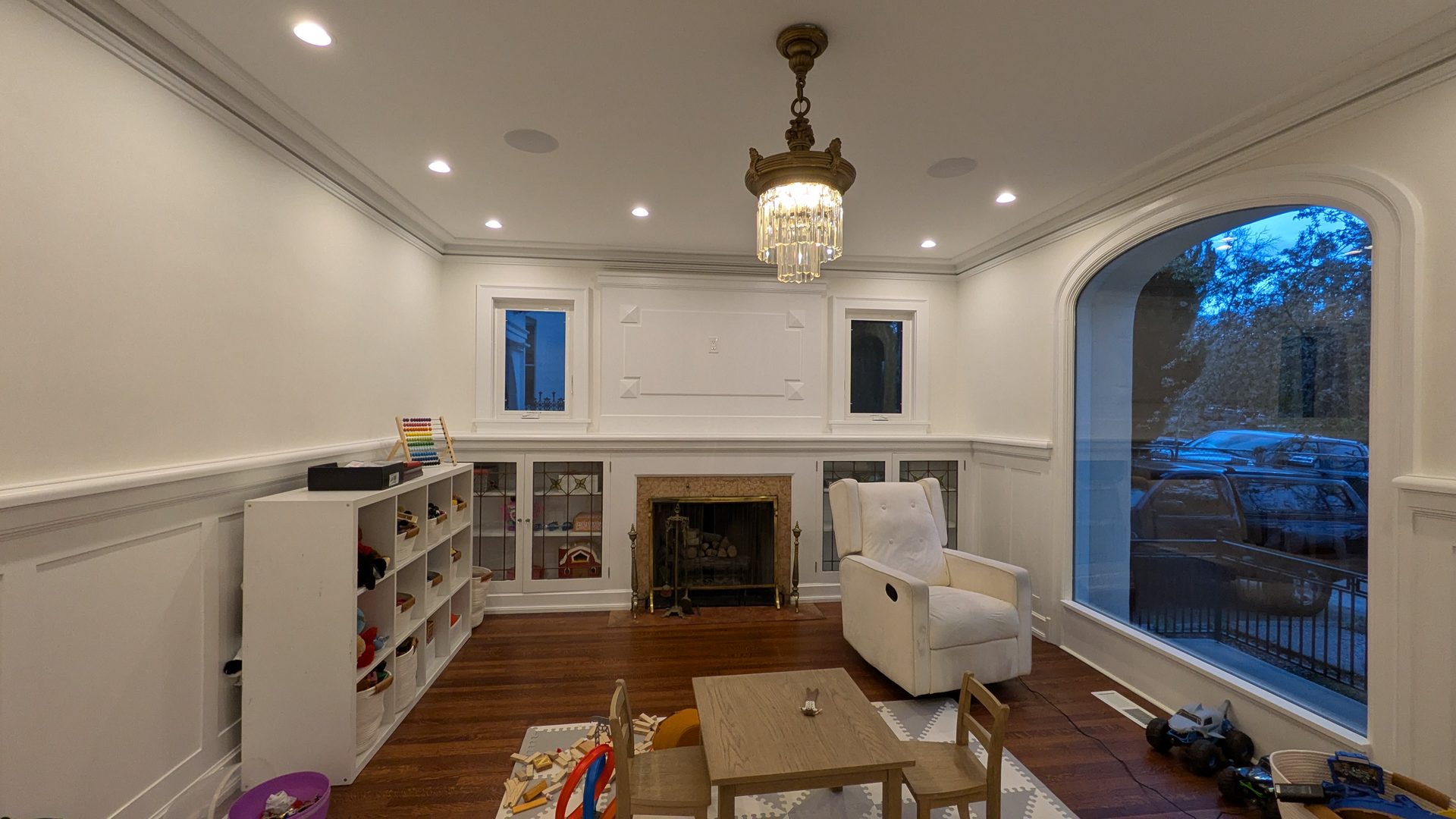 Living room with custom built-in bookcases and fireplace by The Robbers Roost